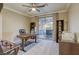 Well-lit home office with patio access features desk space and open shelving at 2737 Josephine Dr, Henderson, NV 89044