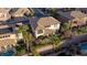 Spacious outdoor area featuring a well-manicured lawn, mature palms and a covered patio at 2737 Josephine Dr, Henderson, NV 89044