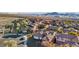 A captivating aerial view of a community featuring tile roofs and desert landscaping in a scenic location at 2809 Proust Ct, Henderson, NV 89044