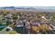 Beautiful aerial view of a home in a vibrant community featuring a tile roof and nearby amenities, with mountain views at 2809 Proust Ct, Henderson, NV 89044