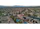 Stunning aerial view of the community featuring solar panels, desert landscaping, mountain views, and pools at 2809 Proust Ct, Henderson, NV 89044