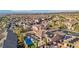 A vibrant community is captured from above, displaying homes with pools, patios, and desert landscape design at 2809 Proust Ct, Henderson, NV 89044