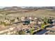 This eye-level image features desert landscaping, pools, and residences, creating a captivating view of the community at 2809 Proust Ct, Henderson, NV 89044