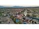 An aerial view of the community showcasing desert landscaping, mountain views, solar panels, and home's location at 2809 Proust Ct, Henderson, NV 89044