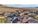 Scenic view of residences featuring tile roofs, desert landscaping, and community charm at 2809 Proust Ct, Henderson, NV 89044