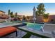 Stunning pool area with modern design, lush landscaping, and relaxing lounge chairs perfect for leisure at 2809 Proust Ct, Henderson, NV 89044