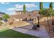 Outdoor patio area for dining and entertaining, complemented by well-maintained backyard at 2809 Proust Ct, Henderson, NV 89044