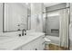 Well-lit bathroom with a white vanity, modern fixtures, and a shower-tub combination at 2809 Proust Ct, Henderson, NV 89044