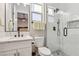 Modern bathroom featuring a glass enclosed shower, white subway tile, and a marble countertop vanity with a black faucet at 2809 Proust Ct, Henderson, NV 89044