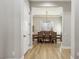 View of a formal dining room with a modern chandelier and table set for eight at 2809 Proust Ct, Henderson, NV 89044