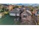Striking aerial view of a home boasting a spacious driveway, a three-car garage, and desert landscaping at 2809 Proust Ct, Henderson, NV 89044