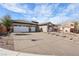 Well-maintained home with a two-car garage, patterned driveway, and attractive landscaping at 2809 Proust Ct, Henderson, NV 89044