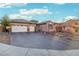 Lovely single-story home with a two-car garage, decorative driveway, and landscaped yard at 2809 Proust Ct, Henderson, NV 89044