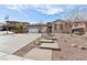 Attractive home with a two-car garage, decorative driveway, and stepping stones leading to the entrance at 2809 Proust Ct, Henderson, NV 89044