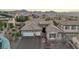 Aerial shot of home showing a three car garage, tile roof, neutral stucco, and desert landscaping at 2809 Proust Ct, Henderson, NV 89044