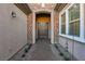 Inviting front entrance featuring stone accents, a covered entryway, and a beautiful double door at 2809 Proust Ct, Henderson, NV 89044