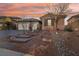 Charming front exterior with manicured landscaping, stone accents, three-car garage, and inviting walkway at 2809 Proust Ct, Henderson, NV 89044