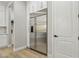Kitchen boasts stainless steel refrigerator, white cabinets, and stainless hardware at 2809 Proust Ct, Henderson, NV 89044