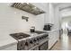 Stainless steel range with white range hood, white countertops, and stainless steel appliances at 2809 Proust Ct, Henderson, NV 89044
