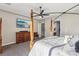 Bedroom with a four-poster bed, TV, ceiling fan, carpet, and access to the Primary bathroom at 2809 Proust Ct, Henderson, NV 89044