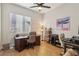 Bright office with a ceiling fan, a large window, hardwood floors and a sewing station at 2809 Proust Ct, Henderson, NV 89044