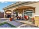 Charming covered patio with outdoor seating, offering a relaxing space for entertaining and enjoying the beautiful scenery at 2809 Proust Ct, Henderson, NV 89044