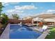 Stunning pool with lounge chairs, perfect for relaxation and enjoying the beautiful backyard oasis at 2809 Proust Ct, Henderson, NV 89044
