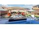 Luxurious pool area featuring a modern spa, comfortable lounge chairs, and pristine landscaping for relaxation and enjoyment at 2809 Proust Ct, Henderson, NV 89044