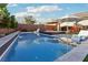 Sparkling swimming pool and spa offer a refreshing oasis in this luxurious backyard at 2809 Proust Ct, Henderson, NV 89044