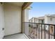 This is a private balcony with black metal railings and views of the neighborhood and other townhouse-style units at 2813 Riverside Gold Ct, North Las Vegas, NV 89086