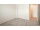 An empty bedroom features neutral carpet, a closet with sliding doors, and a white door at 2813 Riverside Gold Ct, North Las Vegas, NV 89086