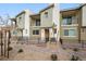 Inviting townhome with individual patios and desert landscaping in a well-maintained community at 2813 Riverside Gold Ct, North Las Vegas, NV 89086
