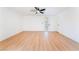 Bright and airy living room featuring wood-look floors, a ceiling fan, and ample natural light at 2878 El Cajon St, Las Vegas, NV 89169