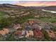 A luxurious neighborhood near a golf course and lake provides scenic views of the valley and surrounding mountains at 3 Rue Allard Way, Henderson, NV 89011