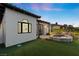 Spacious backyard with a pool, hot tub, and lush green grass at 3 Rue Allard Way, Henderson, NV 89011