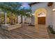Spacious courtyard featuring wood-look tile flooring, a mature tree, and gated access at 3 Rue Allard Way, Henderson, NV 89011