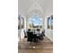 Bright dining nook features a modern chandelier, vaulted ceilings, and large windows with mountain views at 3 Rue Allard Way, Henderson, NV 89011
