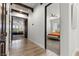 Hallway with wood floors leads to bedrooms and living spaces at 3 Rue Allard Way, Henderson, NV 89011