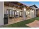 Covered patio space featuring an outdoor dining area, ceiling fan, and backyard access at 3 Rue Allard Way, Henderson, NV 89011