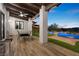 Outdoor living space featuring ceiling fan, wood beam ceiling, dining table, and views of the pool at 3 Rue Allard Way, Henderson, NV 89011