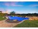 Stunning backyard pool is surrounded by rock accents and beautiful views at 3 Rue Allard Way, Henderson, NV 89011