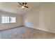 Bright bedroom features a large window and plush carpeting at 3408 Winterhaven St # 204, Las Vegas, NV 89108