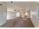 Open-concept living room with fireplace and access to kitchen at 3408 Winterhaven St # 204, Las Vegas, NV 89108