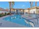 A refreshing community pool sparkles in front of the condominiums, framed by palm trees, in a tranquil outdoor setting at 3408 Winterhaven St # 204, Las Vegas, NV 89108