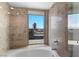 This bathroom features tile throughout with a walk in shower, and large soaking tub at 360 E Desert Inn Rd # 1903, Las Vegas, NV 89109