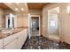 Spacious bathroom with dual sinks, walk-in shower, and elegant marble flooring at 360 E Desert Inn Rd # 1903, Las Vegas, NV 89109