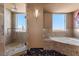 This bathroom features a tile shower with large windows, and a large soaking tub at 360 E Desert Inn Rd # 1903, Las Vegas, NV 89109