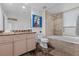 Elegant bathroom featuring a marble countertop, bathtub with shower, and sophisticated decor at 360 E Desert Inn Rd # 1903, Las Vegas, NV 89109