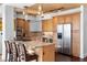 A modern kitchen features a large island with bar seating and stainless-steel appliances at 360 E Desert Inn Rd # 1903, Las Vegas, NV 89109