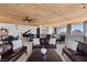 Spacious living area with leather sofas, a grand piano, and floor-to-ceiling windows with city views at 360 E Desert Inn Rd # 1903, Las Vegas, NV 89109